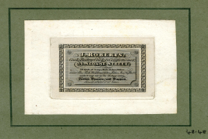 Ein Foto Rahmen mit einer Aktie mit der Aufschrift "J.R. Roberts, Inc." und verschiedenen Zahlen.